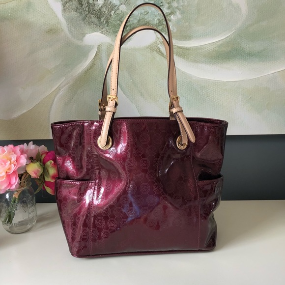 Michael Kors Handbags - Michael Kors tote metallic burgundy EUC